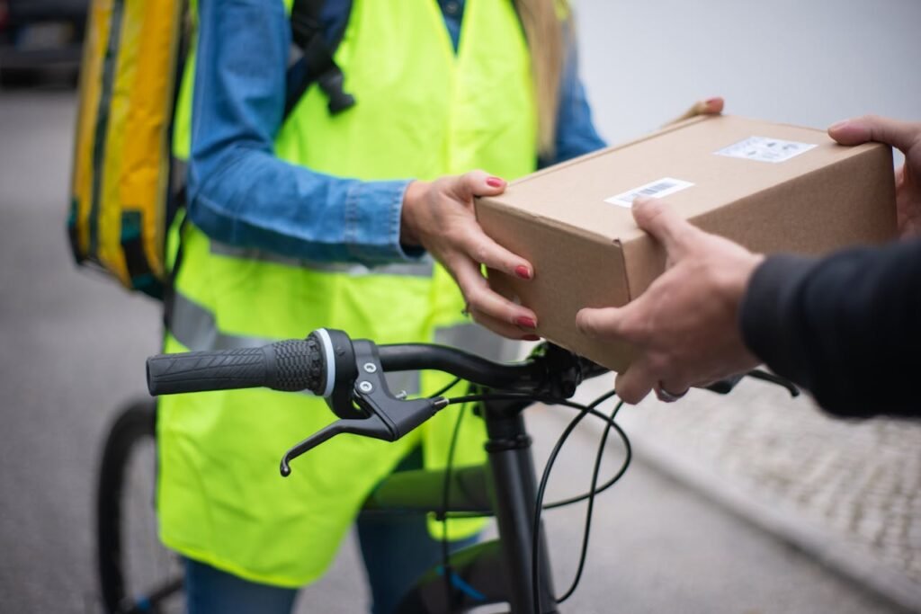 A Person Holding a Brown Box